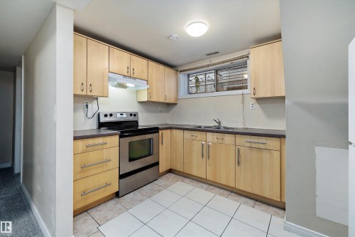 12828 125 Street, Edmonton, AB - Indoor Photo Showing Kitchen With Stainless Steel Kitchen With Double Sink