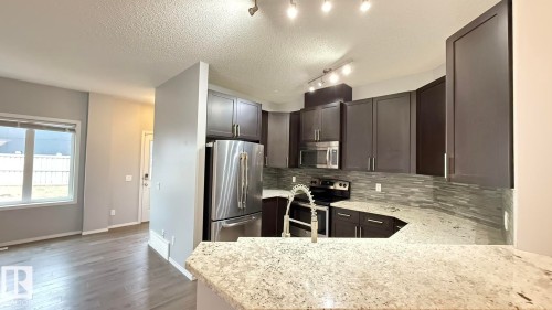 7185 Cardinal Way, Edmonton, AB - Indoor Photo Showing Kitchen With Double Sink With Upgraded Kitchen