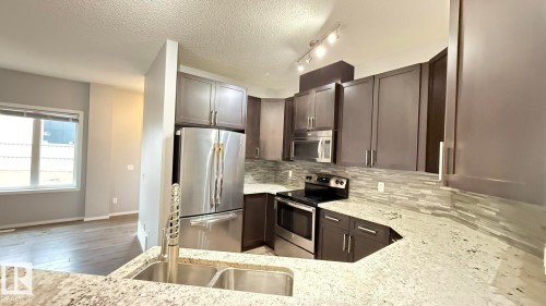 7185 Cardinal Way, Edmonton, AB - Indoor Photo Showing Kitchen With Double Sink With Upgraded Kitchen