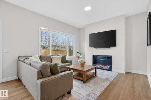 140 Rancher Road, Ardrossan, AB - Indoor Photo Showing Living Room With Fireplace