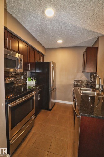 124 12025 22 Avenue, Edmonton, AB - Indoor Photo Showing Kitchen With Stainless Steel Kitchen With Double Sink