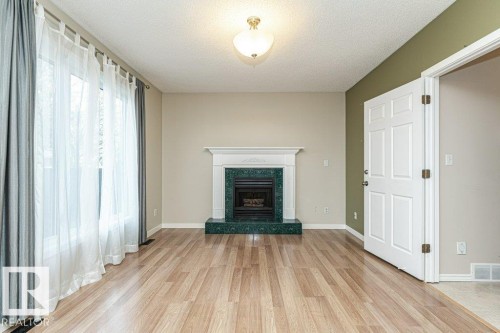 9717 85A Street, Fort Saskatchewan, AB - Indoor Photo Showing Living Room With Fireplace