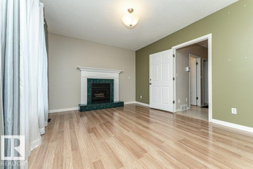 9717 85A Street, Fort Saskatchewan, AB - Indoor Photo Showing Living Room With Fireplace