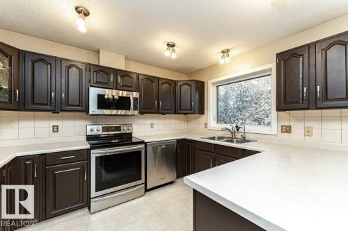 9717 85A Street, Fort Saskatchewan, AB - Indoor Photo Showing Kitchen With Double Sink