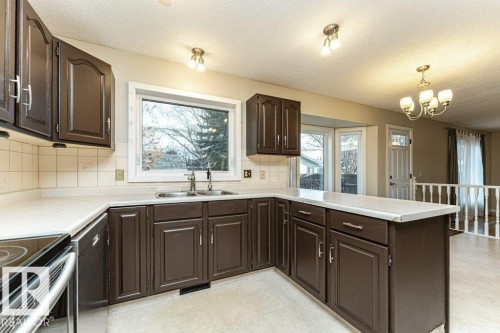 9717 85A Street, Fort Saskatchewan, AB - Indoor Photo Showing Kitchen With Double Sink