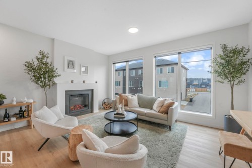 488 38A Street, Edmonton, AB - Indoor Photo Showing Living Room With Fireplace