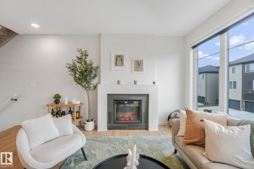 488 38A Street, Edmonton, AB - Indoor Photo Showing Living Room With Fireplace