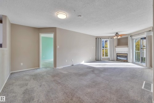 305 10221 111 Street, Edmonton, AB - Indoor Photo Showing Other Room With Fireplace