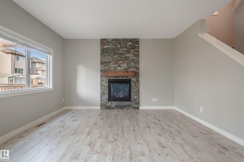 7298 Edgemont Way, Edmonton, AB - Indoor Photo Showing Living Room With Fireplace