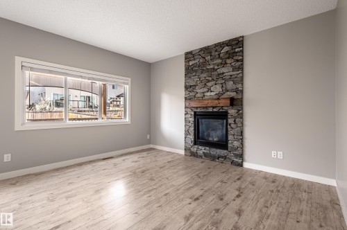 7298 Edgemont Way, Edmonton, AB - Indoor Photo Showing Living Room With Fireplace