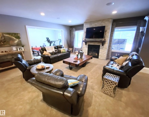 2 53120 Rge Road 15, Rural Parkland County, AB - Indoor Photo Showing Living Room With Fireplace