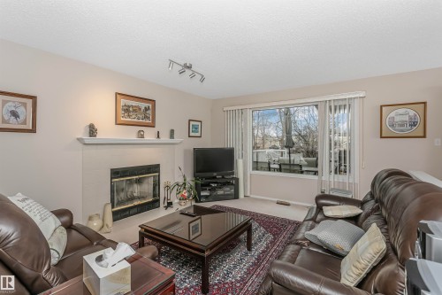 701 Revell Crescent, Edmonton, AB - Indoor Photo Showing Living Room With Fireplace