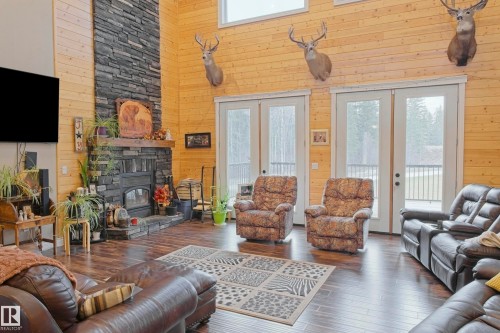 620081 Rge Rd 62, Rural Woodlands County, AB - Indoor Photo Showing Living Room With Fireplace