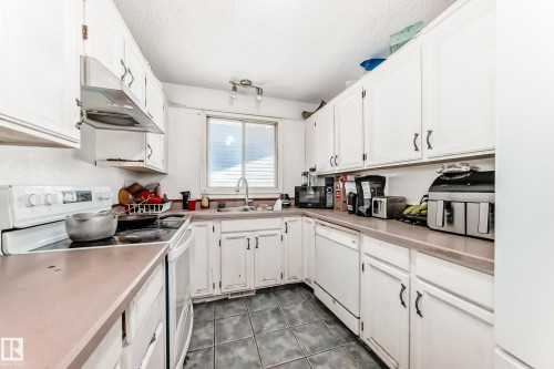 5144 37 Avenue, Edmonton, AB - Indoor Photo Showing Kitchen With Double Sink