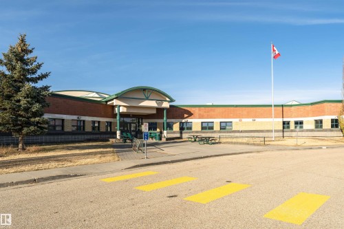 View of commercial property with uncovered parking - 108 2305 35A Avenue, Edmonton, AB - Outdoor