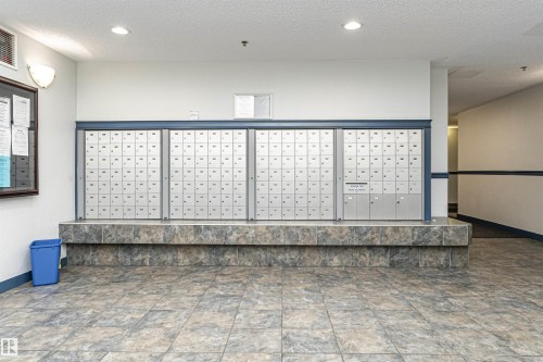 View of community with a textured ceiling, mail area, and recessed lighting - 108 2305 35A Avenue, Edmonton, AB - Indoor Photo Showing Other Room