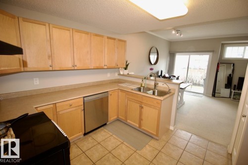 4 1179 Summerside Drive, Edmonton, AB - Indoor Photo Showing Kitchen With Double Sink