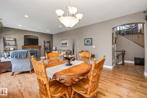 39 Hillside Terrace, Fort Saskatchewan, AB - Indoor Photo Showing Dining Room With Fireplace
