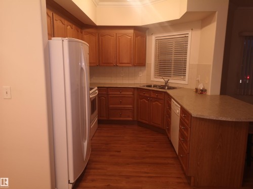 218 8528 82 Avenue Nw, Edmonton, AB - Indoor Photo Showing Kitchen With Double Sink