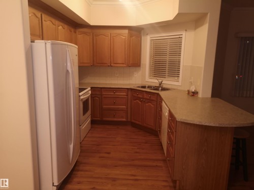 218 8528 82 Avenue Nw, Edmonton, AB - Indoor Photo Showing Kitchen With Double Sink