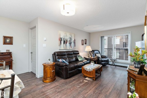 213 5510 Schonsee Drive, Edmonton, AB - Indoor Photo Showing Living Room