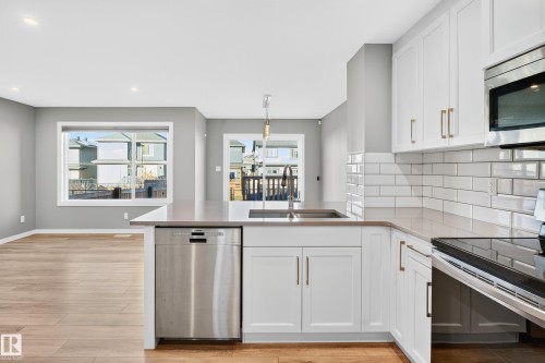244 Larch Crescent, Leduc, AB - Indoor Photo Showing Kitchen With Double Sink