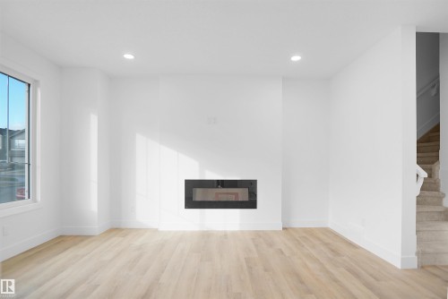 786 Cy Becker Drive, Edmonton, AB - Indoor Photo Showing Living Room With Fireplace