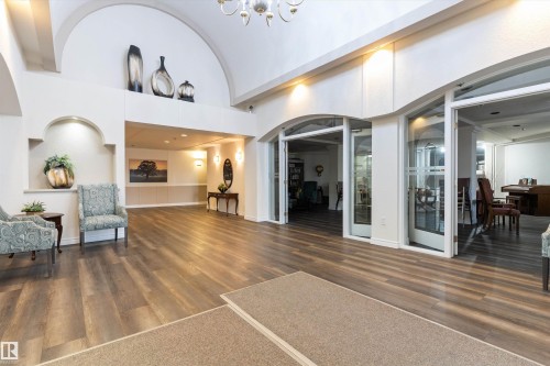 Community lobby featuring high vaulted ceiling - 209 10915 21 Avenue, Edmonton, AB 