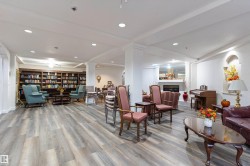 Common area with recessed lighting and beam ceiling - 