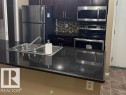 106 111 Watt Common Sw, Edmonton, AB  - Indoor Photo Showing Kitchen With Double Sink With Upgraded Kitchen 