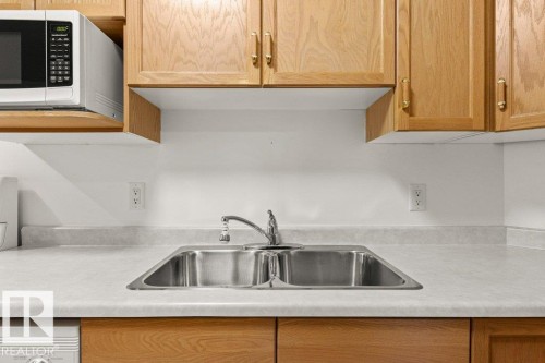 104 2741 55 Street, Edmonton, AB - Indoor Photo Showing Kitchen With Double Sink