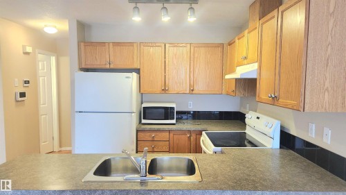 181 230 Edwards Drive, Edmonton, AB - Indoor Photo Showing Kitchen With Double Sink