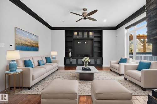 Living area featuring wood finished floors, ornamental molding, a ceiling fan, and recessed lighting - 8536 19 Avenue, Edmonton, AB - Indoor Photo Showing Living Room