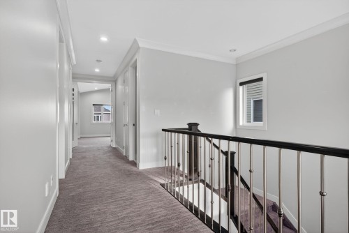 Corridor featuring carpet floors, an upstairs landing, recessed lighting, and ornamental molding - 8536 19 Avenue, Edmonton, AB - Indoor Photo Showing Other Room