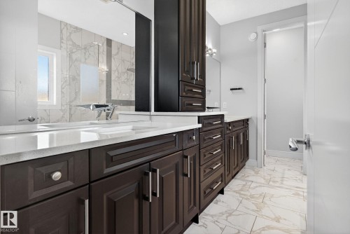 Full bathroom featuring light marble finish flooring and vanity - 8536 19 Avenue, Edmonton, AB - Indoor Photo Showing Bathroom