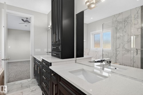 Bathroom with light marble finish floors, a marble finish shower, and vanity - 8536 19 Avenue, Edmonton, AB - Indoor Photo Showing Bathroom