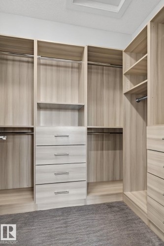 View of walk in closet - 8536 19 Avenue, Edmonton, AB - Indoor With Storage