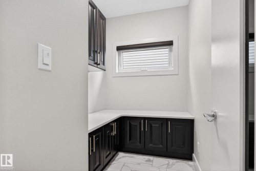 Bathroom with light marble finish flooring and vanity - 8536 19 Avenue, Edmonton, AB - Indoor