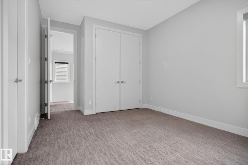 Unfurnished bedroom with carpet floors and a closet - 8536 19 Avenue, Edmonton, AB - Indoor Photo Showing Other Room