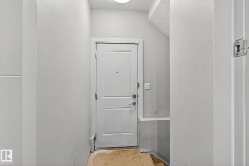 Entryway featuring a textured ceiling - 8536 19 Avenue, Edmonton, AB - Indoor Photo Showing Other Room