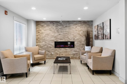 513 5 St Louis Street, St. Albert, AB - Indoor Photo Showing Living Room With Fireplace