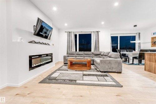 6205 46 Avenue, Beaumont, AB - Indoor Photo Showing Living Room With Fireplace