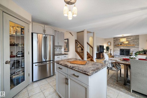 1060 Wedgewood Boulevard, Edmonton, AB - Indoor Photo Showing Kitchen With Fireplace