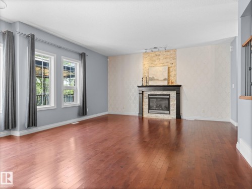 5116 Chateau Court, Beaumont, AB - Indoor Photo Showing Living Room With Fireplace
