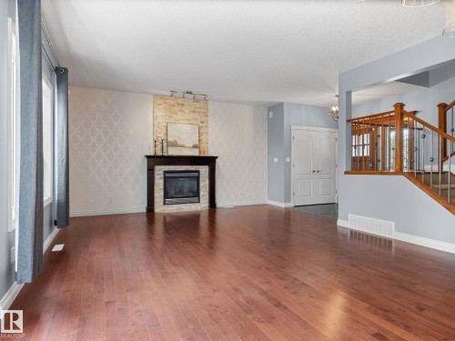 5116 Chateau Court, Beaumont, AB - Indoor Photo Showing Living Room With Fireplace
