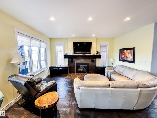 3438 West Landing, Edmonton, AB - Indoor Photo Showing Living Room With Fireplace