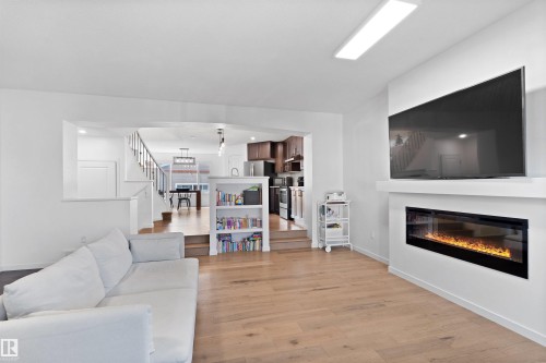 2208 82 Street, Edmonton, AB - Indoor Photo Showing Living Room With Fireplace