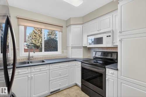 10948 Beaumaris Road, Edmonton, AB - Indoor Photo Showing Kitchen With Double Sink