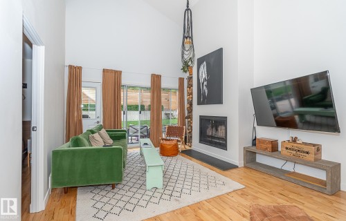 12211 42A Avenue, Edmonton, AB - Indoor Photo Showing Living Room With Fireplace