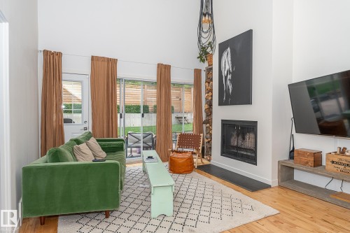 12211 42A Avenue, Edmonton, AB - Indoor Photo Showing Living Room With Fireplace